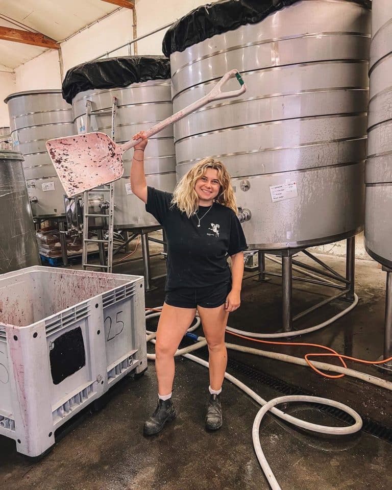 Georgia in Winery holding large shovel